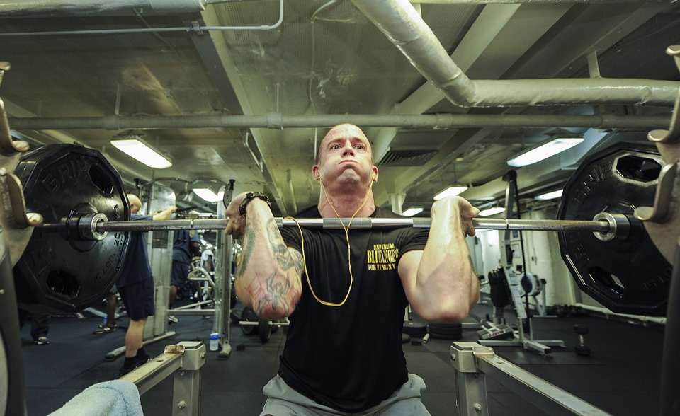 man lifting weights